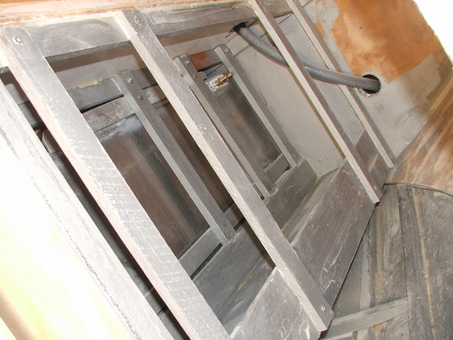 Fuel tank under the cockpit with battery rack alongside